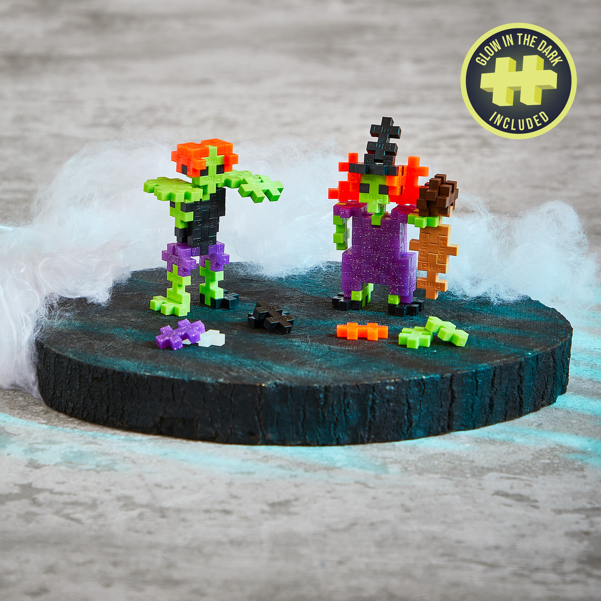 Tube - Monster Mash: green and purple monster builds on a dark platform, with a glow-in-the-dark badge