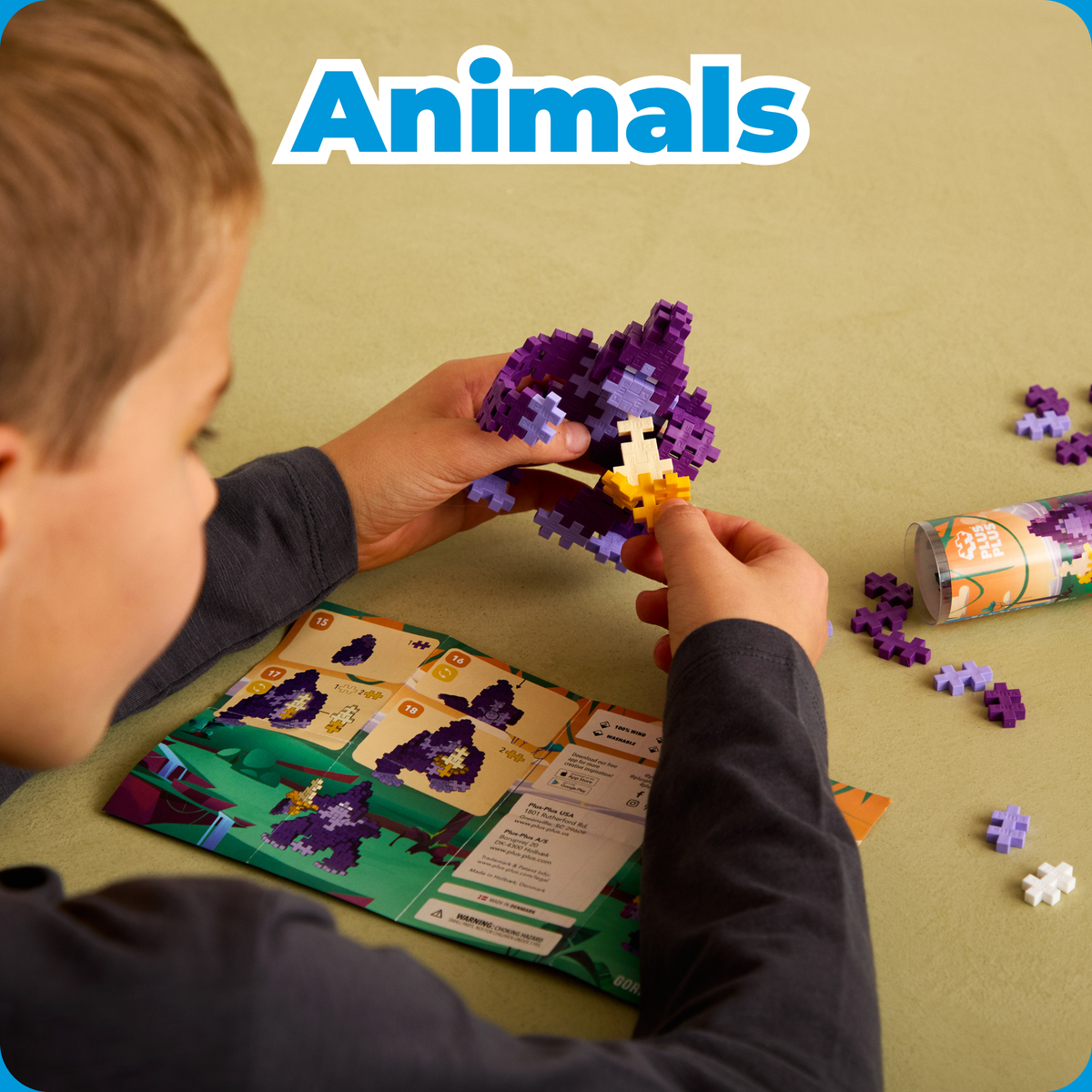 Shop by Theme - Animals: child building a purple Plus-Plus animal