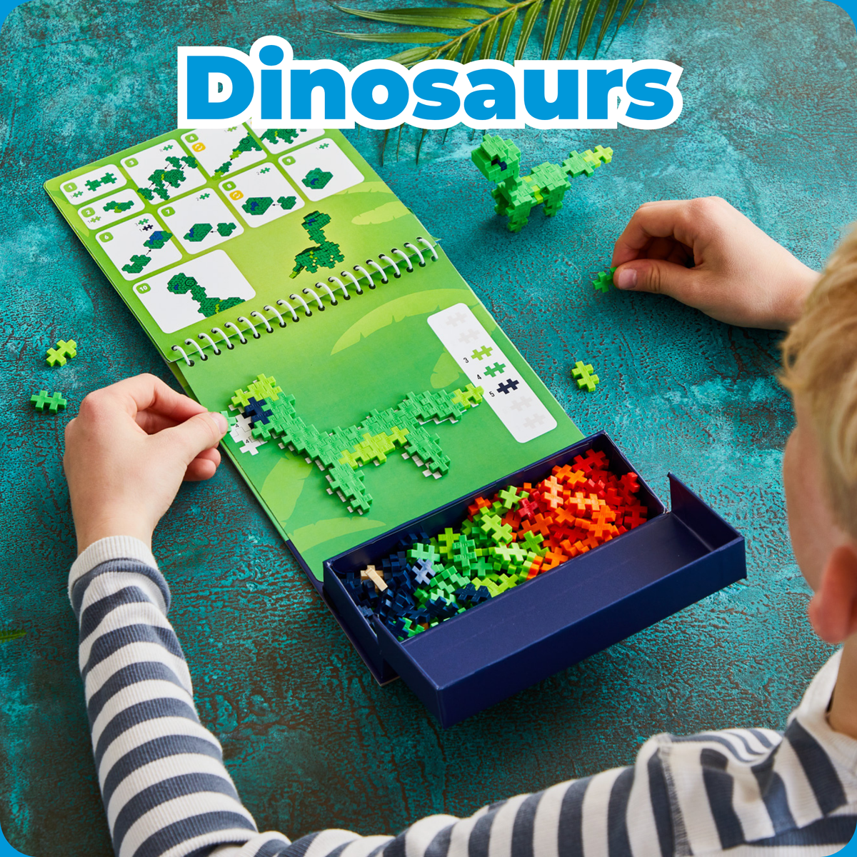 Shop by Theme - Dinosaurs: child building green dinosaurs from a Puzzle By Number activity pad